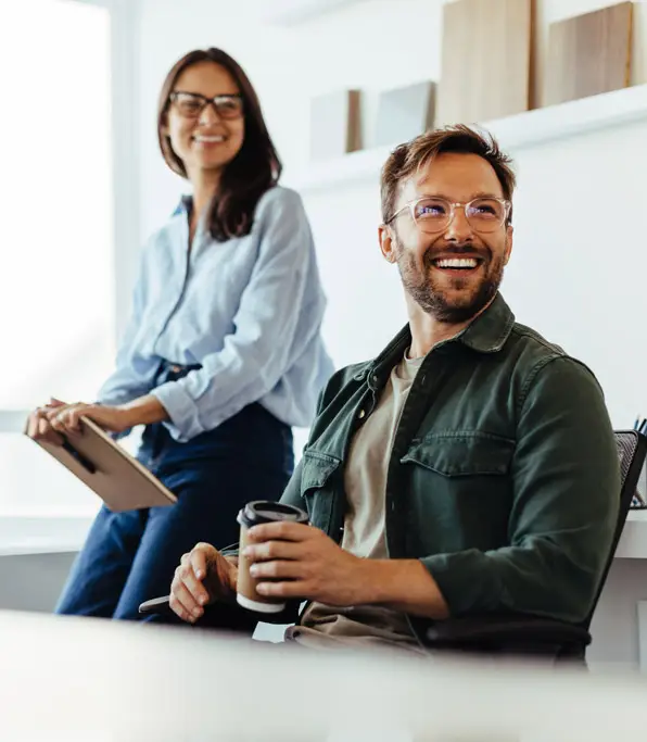 two workers happy to have Akumina Intranet